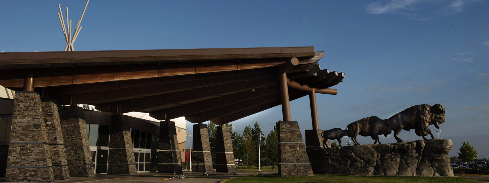 Dakota Dunes Casino entrance with massive buffalo statues at sunset