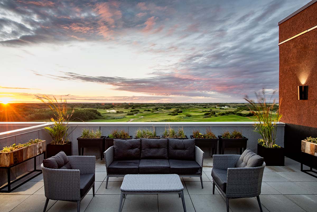 Dakota Dunes Resort rooftop patio at sunrise 